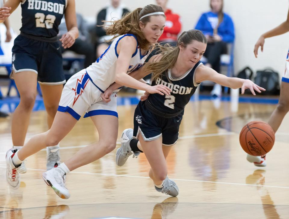 Lake’s Alayna Horning (left) and Hudson’s Ella Kordos go after a loose ball Saturday, Feb. 11, 2023.