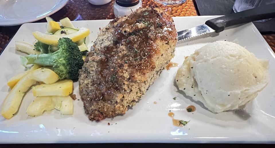 At Fin & Flame Grill and Oyster Bar in Palm City, the Better Bleu was a moist, hefty chicken breast stuffed with tavern ham, Swiss cheese and smeared with creamy, herby Boursin cheese.