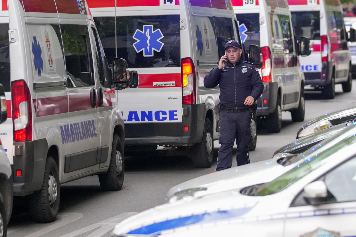 Police blocks street around the Vladislav Ribnikar school in Belgrade, Serbia, Wednesday, May 3, 2023. A teenage boy opened fire early Wednesday in a school in central Belgrade, causing injuries. (AP Photo/Darko Vojinovic)