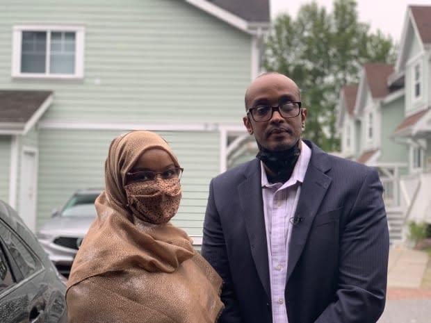 Shahra-sad Mohamed Warsame Ali and her husband Ali Hassan Hersi stand in front of the Burnaby townhouse complex they moved into in 2015 after agreeing to terms with Habitat for Humanity of Greater Vancouver.