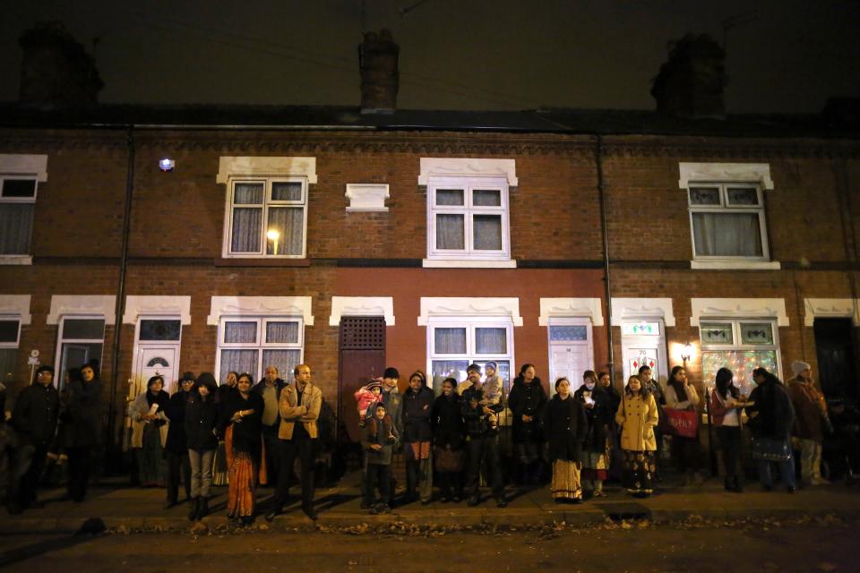 LEICESTER, UNITED KINGDOM - NOVEMBER 13: Families and locals gather to watch fireworks during the Hindu festival of Diwali on November 13, 2012 in Leicester, United Kingdom. Up to 35,000 people attended the Diwali festival of light in Leicester's Golden Mile in the heart of the city's asian community. The festival is an opportunity for Hindus to honour Lakshmi, the goddess of wealth and other gods. Leicester's celebrations are one of the biggest in the world outside India. Sikhs and Jains also celebrate Diwali. (Photo by Christopher Furlong/Getty Images)