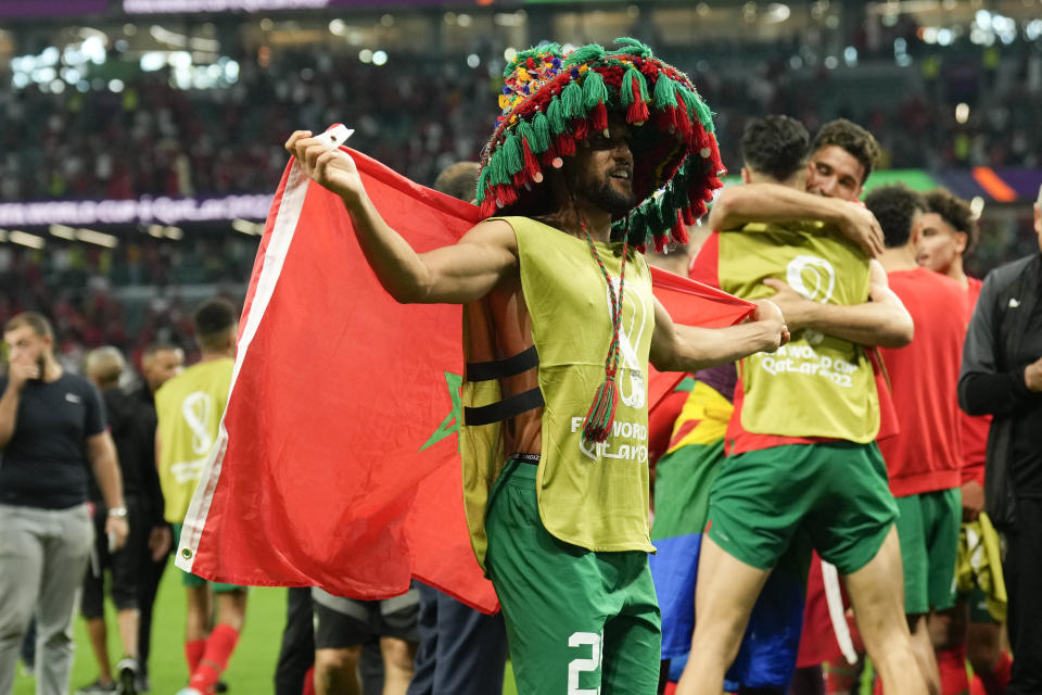 Morocco's Achraf Hakimi celebrates after winning during a penalty shootout of the World Cup round of 16 soccer match between Morocco and Spain, at the Education City Stadium in Al Rayyan, Qatar, Tuesday, Dec. 6, 2022. (AP Photo/Francisco Seco)