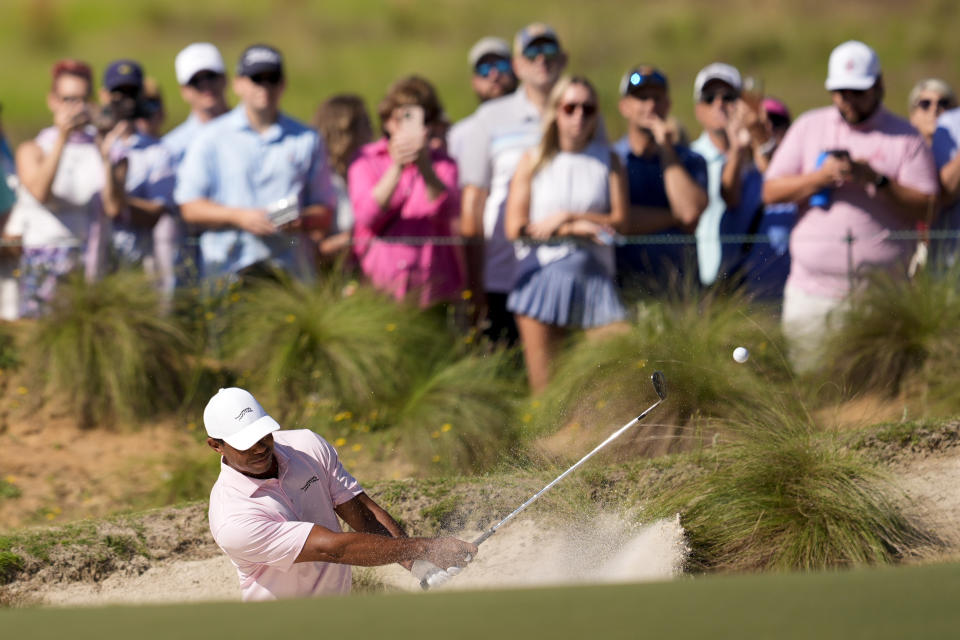 Tiger Woods hits from the bunker on the fifth hole during a practice round for the U.S. Open golf tournament Tuesday, June 11, 2024, in Pinehurst, N.C. (AP Photo/George Walker IV)