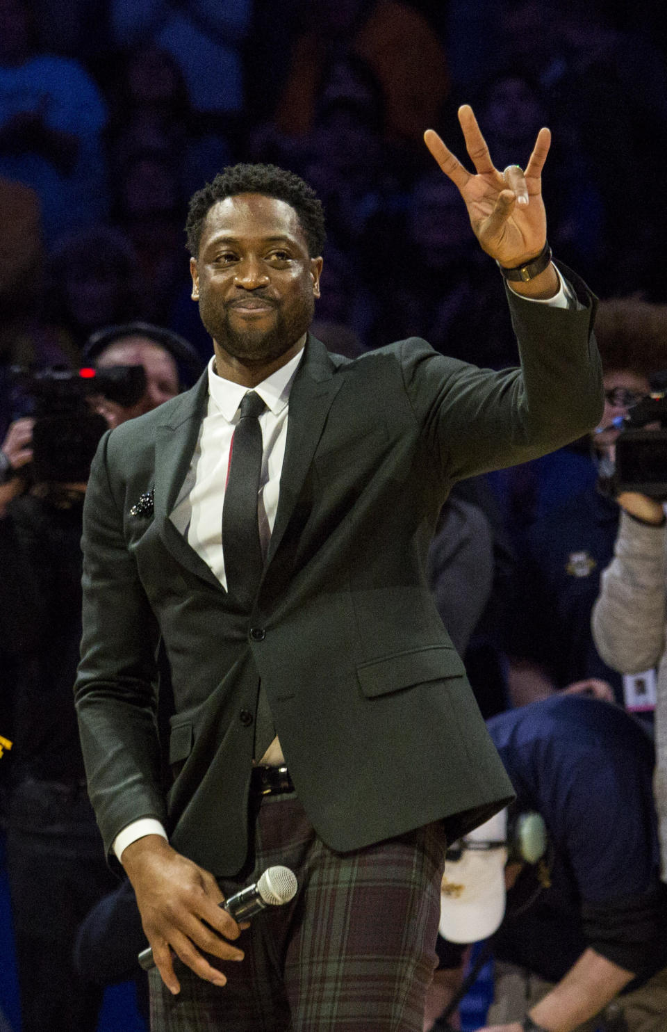 Miami Heat player and Marquette alumni Dwyane Wade is honored with Dwyane Wade Day during half time as Marquette takes on Providence for an NCAA college basketball game Sunday, Jan. 20, 2019, in Milwaukee. (AP Photo/Darren Hauck)