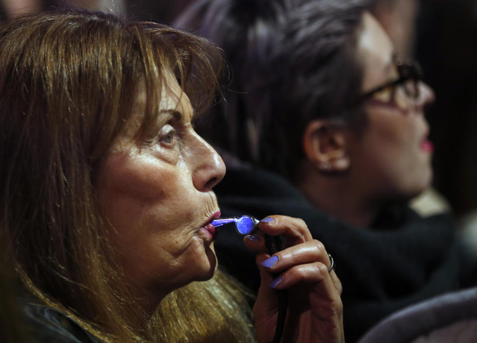 A woman blows whistle during a protest against populist President Aleksandar Vucic in Belgrade, Serbia, Saturday, Dec. 22, 2018. Thousands of people have rallied in another protest in Serbia against populist President Aleksandar Vucic accusing him of stifling hard-won democratic freedoms and cracking down on opponents. (AP Photo/Darko Vojinovic)