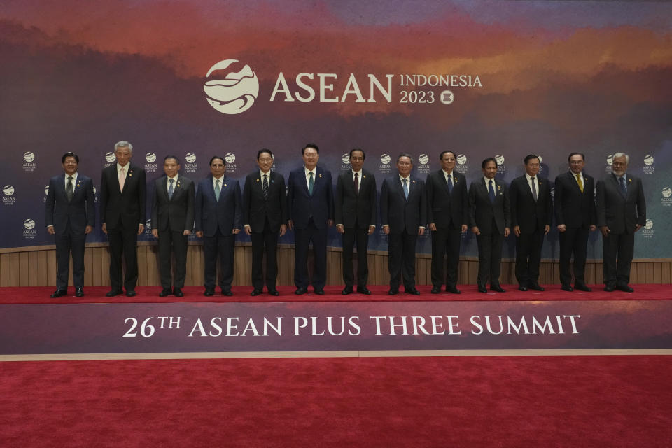 From left to right, Philippine's President Ferdinand Marcos, Jr., Singapore's Prime Minister Lee Hsien Loong, Thailand's Permanent Secretary of the Ministry of Foreign Affairs Sarun Charoensuwan, Vietnam's Prime Minister Pham Minh Chinh, Japan's Prime Minster Fumio Kishida, South Korean President Yoon Suk Yeol, Indonesian President Joko Widodo, Chinese Premier Li Qiang, Laos' Prime Minister Sonexay Siphandone, Brunei's Sultan Hassanal Bolkiah, Cambodia's Prime Minister Hun Manet, Malaysian Prime Minister Anwar Ibrahim and East Timor's Prime Minister Xanana Gusmao pose for a family photo during the Association of the Southeast Asian Nations (ASEAN) Plus Three Summit in Jakarta, Indonesia, Wednesday, Sept. 6, 2023. (AP Photo/Tatan Syuflana, Pool)