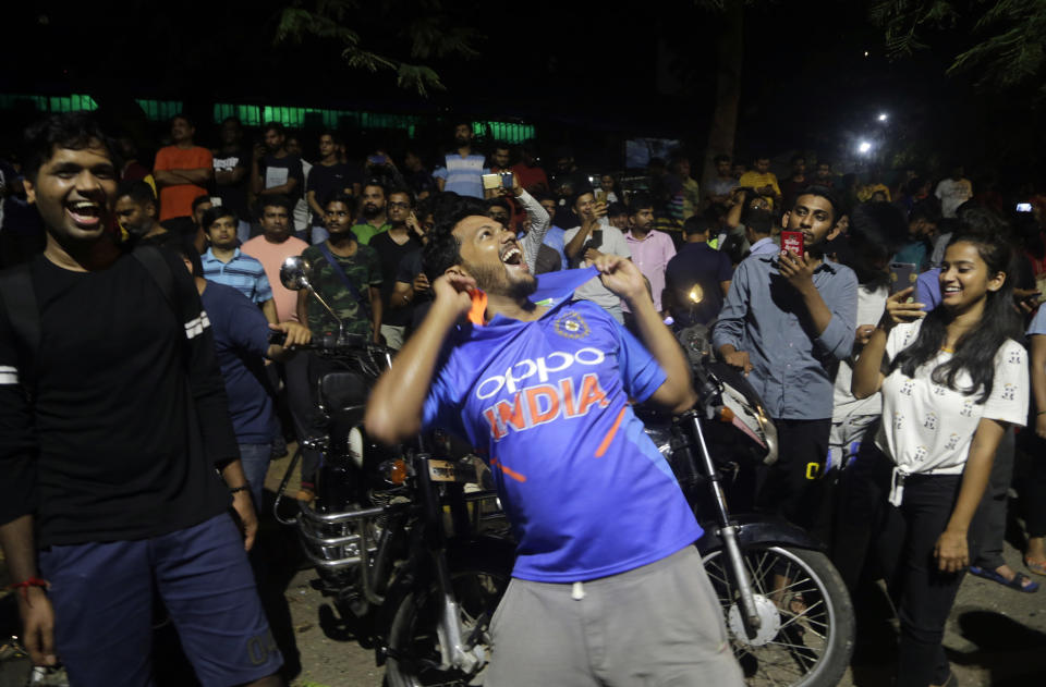 Indians celebrate after their team won the ICC World Cup cricket match against Pakistan, in Mumbai, India, Sunday, June 16, 2019.(AP Photo/Rajanish Kakade)