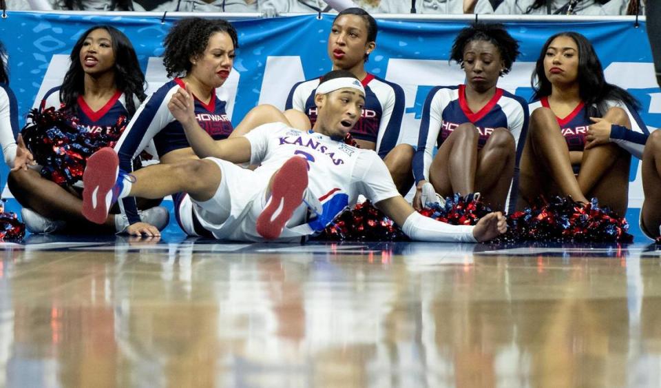 Kansas guard Dajuan Harris Jr. (3) crashes into Howard cheerleaders during a first-round college basketball game in the NCAA Tournament Thursday, March 16, 2023, in Des Moines, Iowa.
