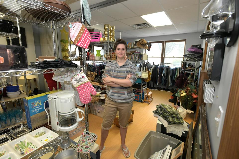 Savannah Kutkat stands in the thrift shop she opened in mid-July in East Peoria. Items at Enough Stuff Thrift Shop & Community Space are not priced. Instead, customers can take them for free, make a donation, or sign up to be a part of a monthly subscription service that supports the shop.