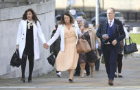 Relatives arrive for the inquest into the Ballymurphy shooting, in Belfast, Northern Ireland, Tuesday May 11, 2021. The findings of the inquest into the deaths of 10 people during an army operation in August 1971 is due to be published on Tuesday. (AP Photo/Peter Morrison)