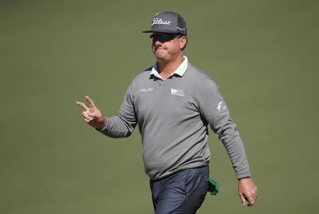 Charley Hoffman of the U.S. reacts after making a birdie putt on the second green in second round play during the 2017 Masters golf tournament at Augusta National Golf Club in Augusta, Georgia, U.S., April 7, 2017. REUTERS/Lucy Nicholson