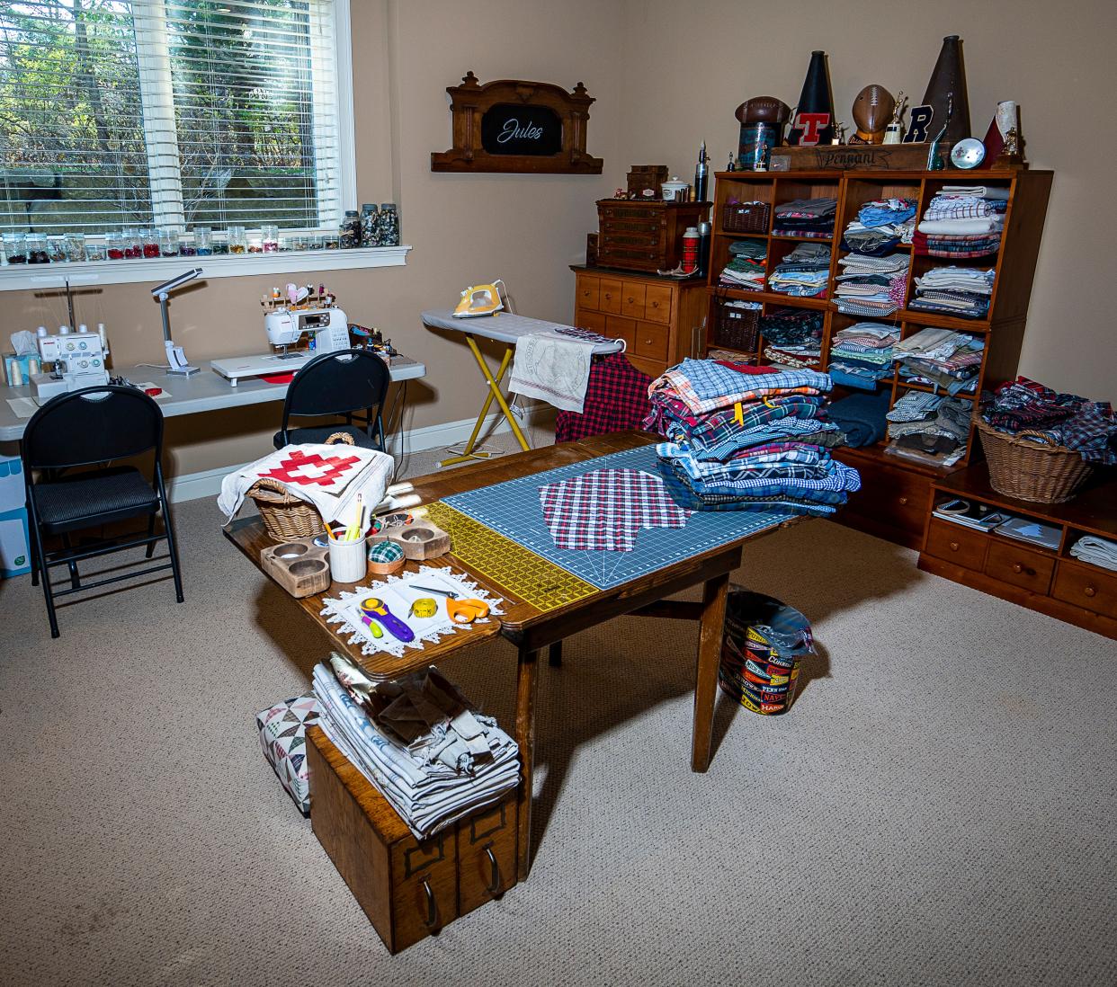 Julie Hunt's work room, where she makes decorative pillows out of a variety of fabrics, including varsity letters and pennants.