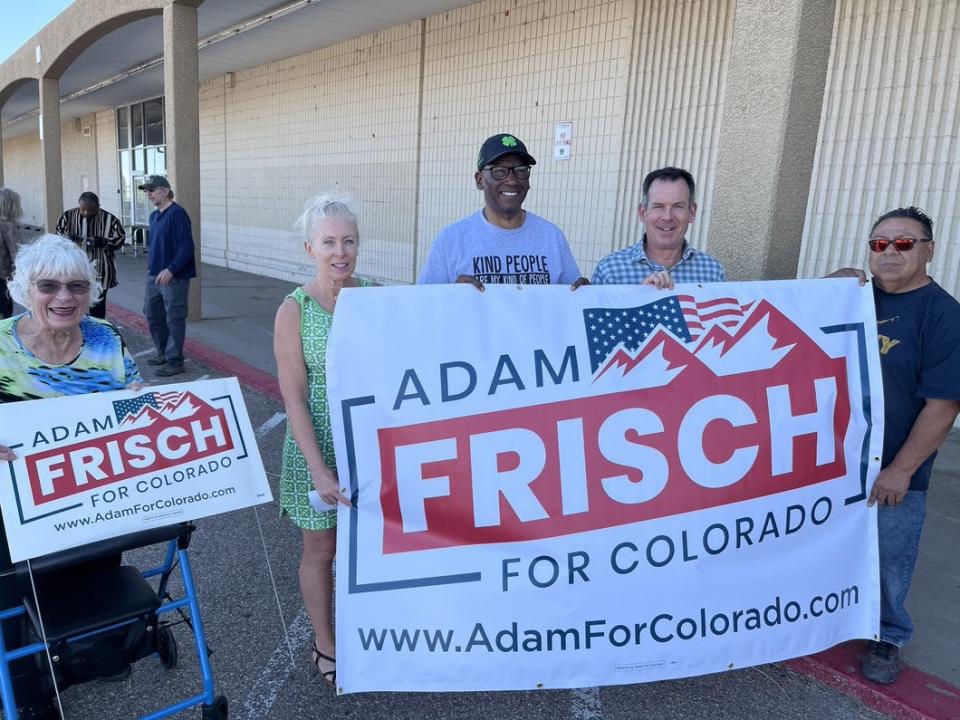 Puebloans show their support for congressional candidate Adam Frisch (second from right) during a recent campaign stop in Pueblo on May 6, 2022.