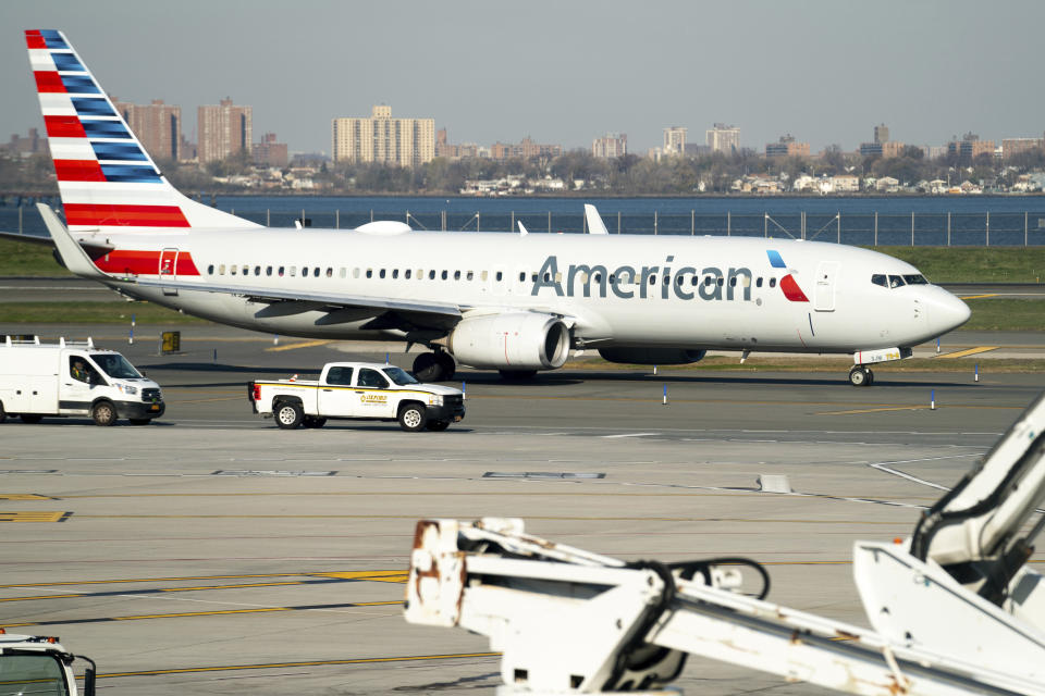 FILE - An American Airlines plane at LaGuardia Airport's Terminal B, Tuesday, Nov. 22, 2022, in New York. American Airlines reports earnings on Thursday, April 27, 2023. (AP Photo/Julia Nikhinson)