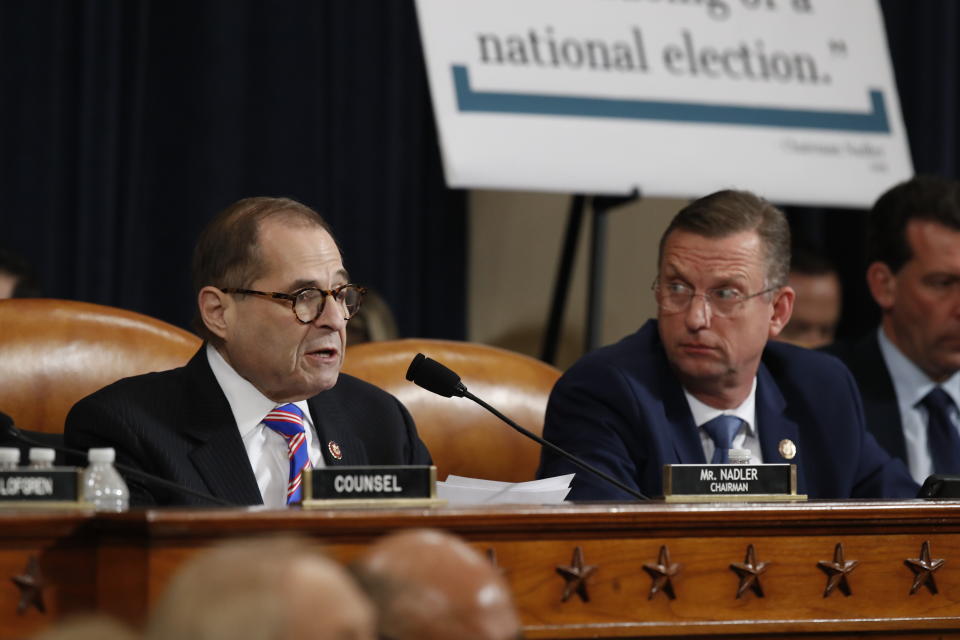 House Judiciary Committee ranking member Rep. Doug Collins, R-Ga., looks over to Chairman Rep. Jerrold Nadler, D-N.Y., left, as he speaks during a hearing before the House Judiciary Committee on the constitutional grounds for the impeachment of President Donald Trump, on Capitol Hill in Washington, Wednesday, Dec. 4, 2019. Republican counsel Paul Taylor, right. (AP Photo/Andrew Harnik)