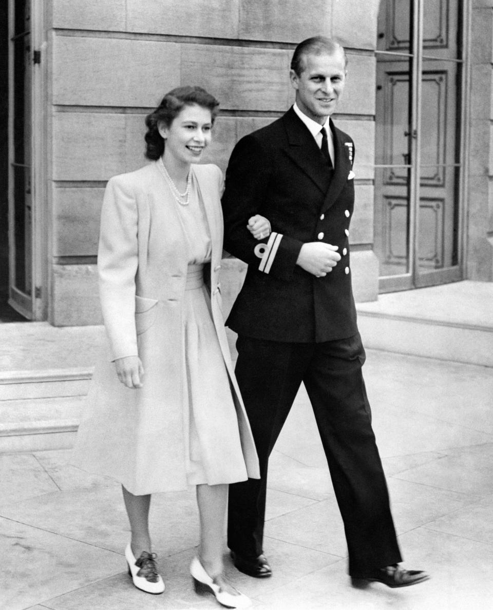 <p>A uniformed Philip stepped out with his brand new fiancée, Princess Elizabeth at Buckingham Palace in July 1947. Photo: Getty Images.</p> 