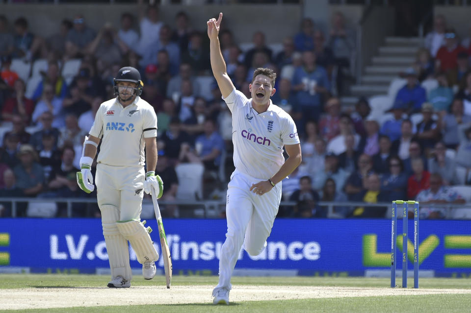 England's Matthew Potts celebrates after dismissing New Zealand's Will Young during the third day of the third cricket test match between England and New Zealand at Headingley in Leeds, England, Saturday, June 25, 2022.. (AP Photo/Rui Vieira)