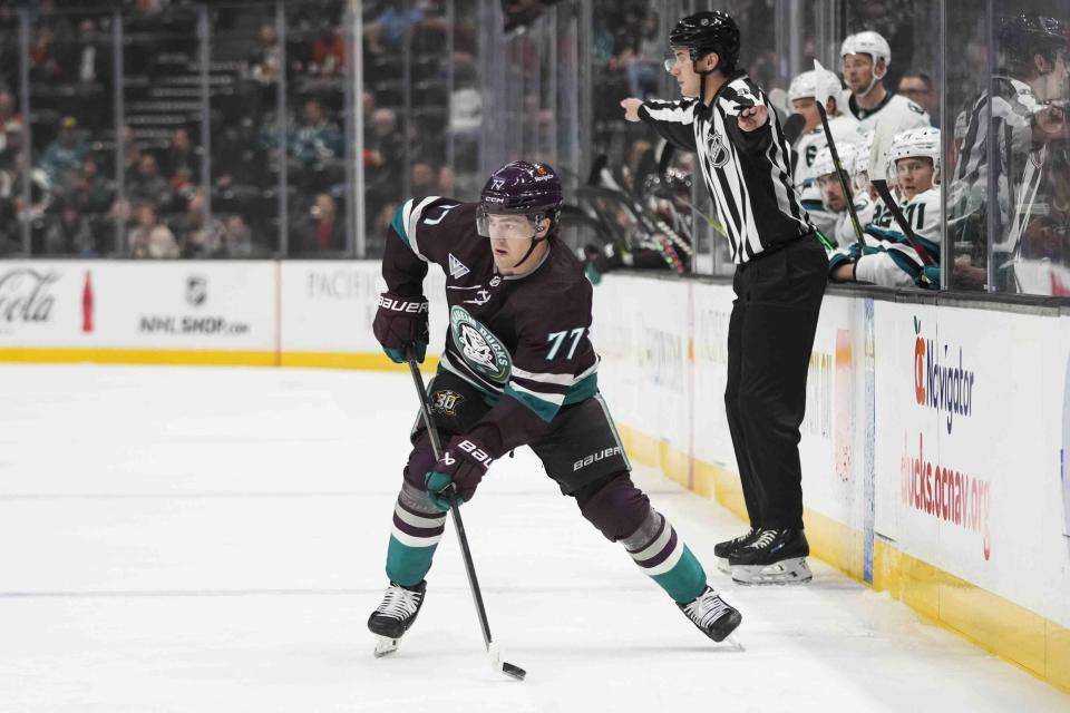 Anaheim Ducks' Frank Vatrano moves the puck during the first period of an NHL hockey game against the San Jose Sharks Sunday, Nov. 12, 2023, in Anaheim, Calif. (AP Photo/Jae C. Hong)
