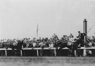 FILE - Cavalcade and jockey Mack Garner cross the finish line ahead of Discovery with jockey John Bejshak in the Kentucky Derby horse race at Churchill Downs in Louisville, Ky., May 5, 1934. (AP Photo)