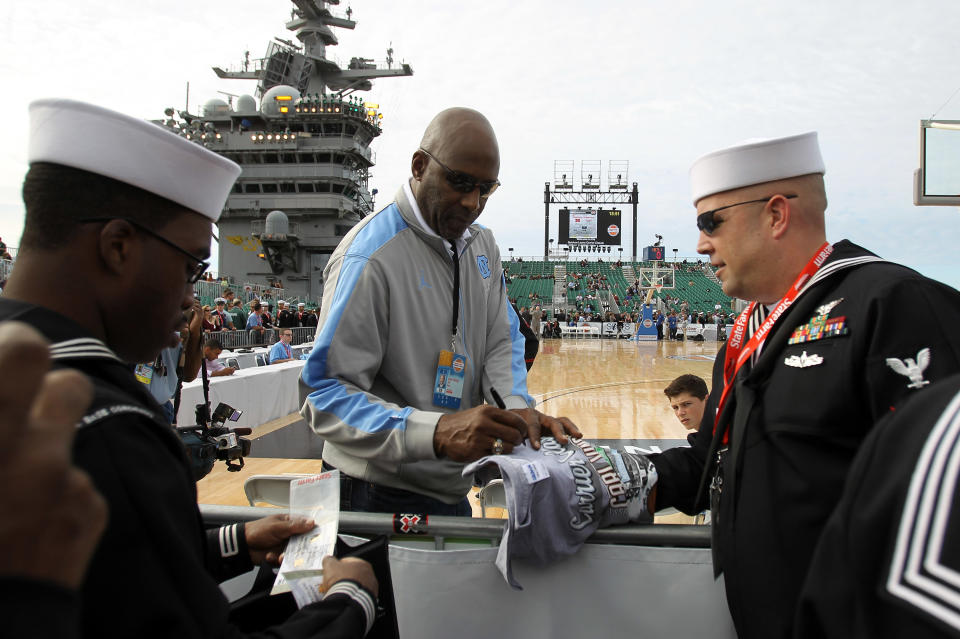 SAN DIEGO, CA - NOVEMBER 11: Basketball hall-of-famer and North Carolina Tar Heels alum James Worthy signs autographs and talks with members of the media before the Tar Heels take on the Michigan State Spartans in the NCAA men's college basketball Carrier Classic aboard the flight deck of the USS Carl Vinson on November 11, 2011 in San Diego, California. (Photo by Ezra Shaw/Getty Images)