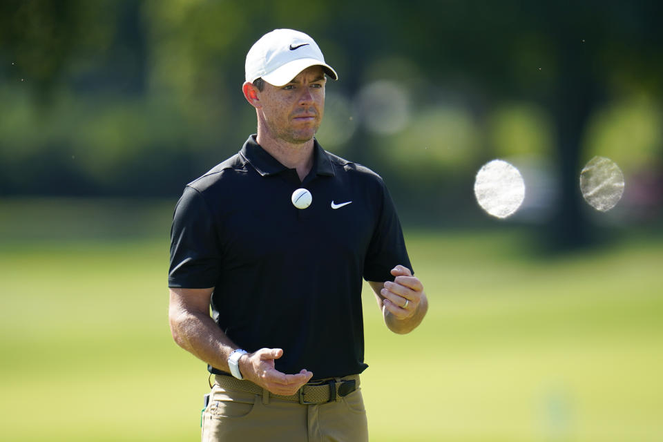 Rory McIlroy, of Northern Ireland, flips a ball after putting on the eighth green during the ProAm at the BMW Championship golf tournament at Wilmington Country Club, Wednesday, Aug. 17, 2022, in Wilmington, Del. The BMW Championship tournament begins on Thursday. (AP Photo/Julio Cortez)