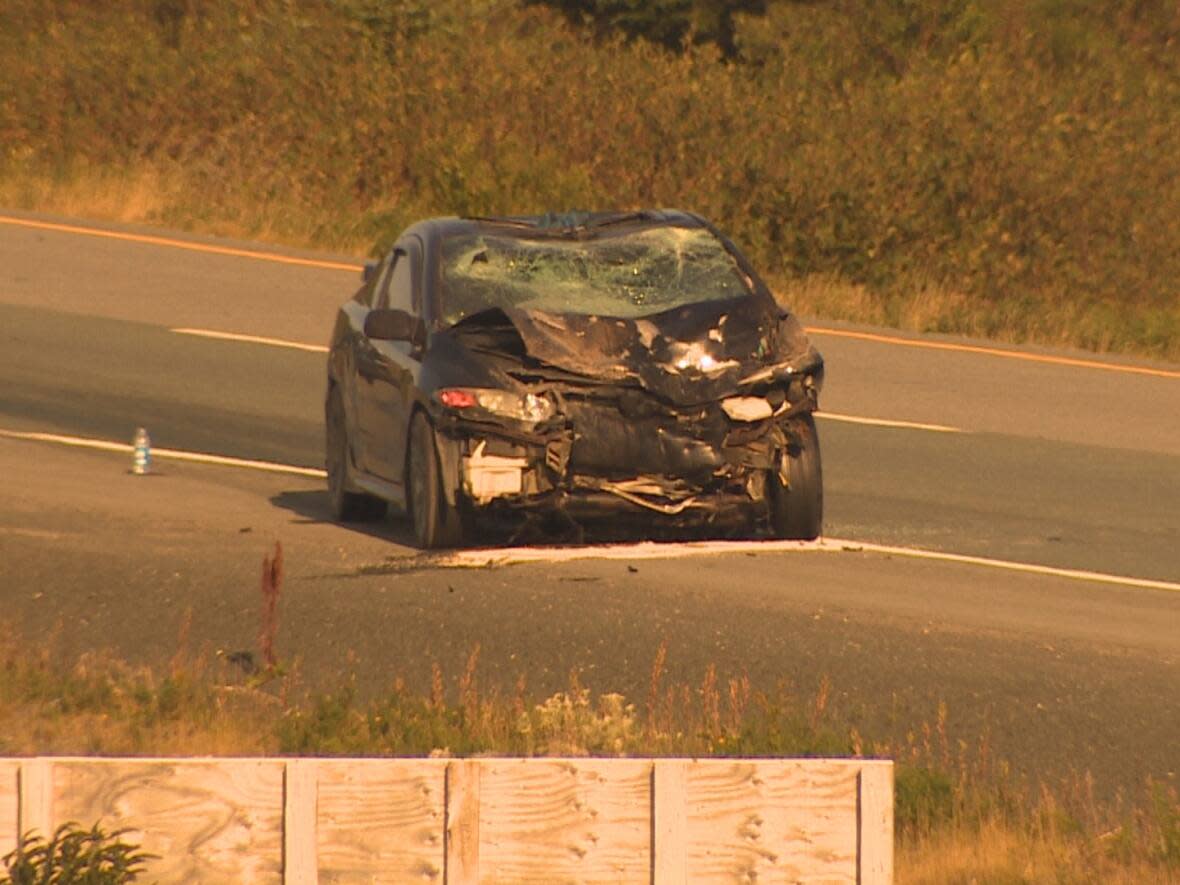 Police have charged two 21-year-old men with dangerous driving causing death in relation to a fatal crash that happened in September on the Trans-Canada Highway near Paddy's Pond. (Ted Dillon/CBC - image credit)