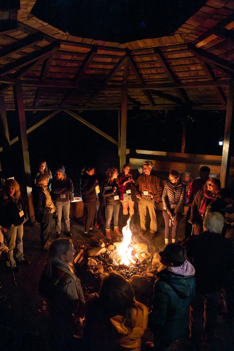 During the evenings, Tremont Writers Conference participants gather to enjoy discussion and fellowship. The first night’s event in 2023 was held in the council house around an inviting fire.