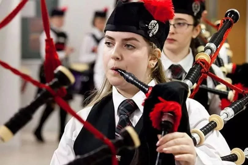 Eilidh playing the bagpipes -Credit:UGC