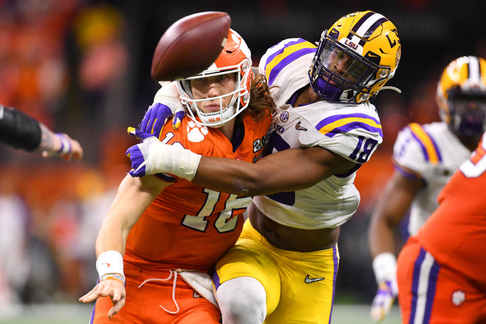 LSU EDGE K'Lavon Chaisson pressures Clemson quarterback Trevor Lawrence during the College Football Playoff national championship at the Mercedes-Benz Superdome on Jan. 13, 2020 in New Orleans, Louisiana. (Photo by Jamie Schwaberow/Getty Images)