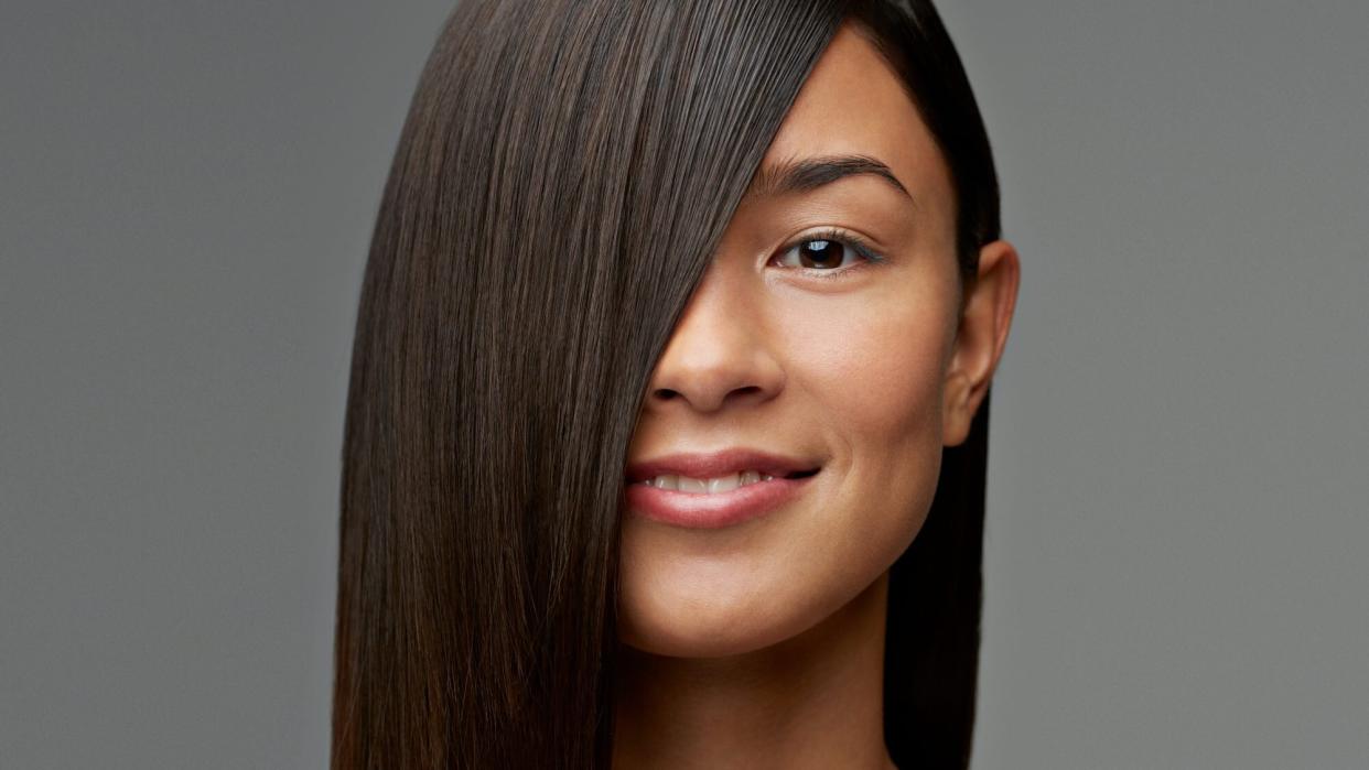 woman with sleek, straight hair