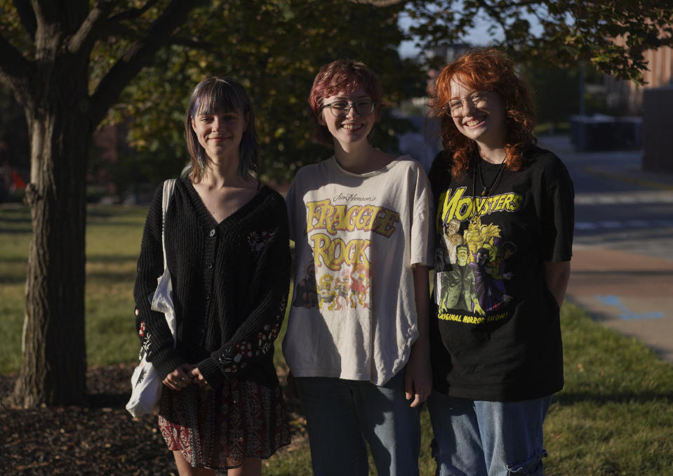 A group of friends and freshmen at the University of Missouri, Sylvia Debruzzi, left, Sarah Woods, center, and Emma Komoroski, right, who all identify as formerly religious, but currently unaffiliated, laugh after having their photo taken while walking through campus Friday, Sept. 8, 2023, in Columbia, Mo. Statistics show that the nones, or religiously unaffiliated, are growing in every age group, but especially among young adults. More than four in 10 of those under 30 are nones – a close second to Christians. (AP Photo/Jessie Wardarski)