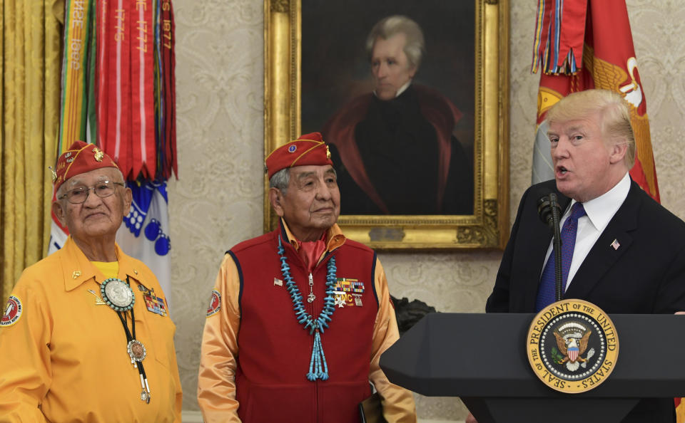 Here's Trump standing with Native American veterans in front of a portrait of Andrew Jackson in the Oval Office. He attacked Elizabeth Warren as "Pocahontas" at this event. (Photo: ASSOCIATED PRESS)