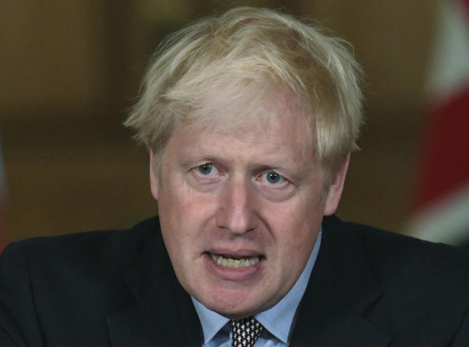 Britain's Prime Minister Boris Johnson speaks during a virtual press conference at Downing Street in London, Wednesday Sept. 9, 2020, following the announcement that the legal limit on social gatherings is set to be reduced from 30 people to six. The change to the "rule of six" with legal status in England, will come into force on upcoming Monday as the Government seeks to curb a recent and ongoing rise in coronavirus cases. (Stefan Rousseau/Pool via AP)