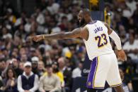 Los Angeles Lakers forward LeBron James yells against the Denver Nuggets during the first half in Game 1 of an NBA basketball first-round playoff series Saturday, April 20, 2024, in Denver. (AP Photo/Jack Dempsey)
