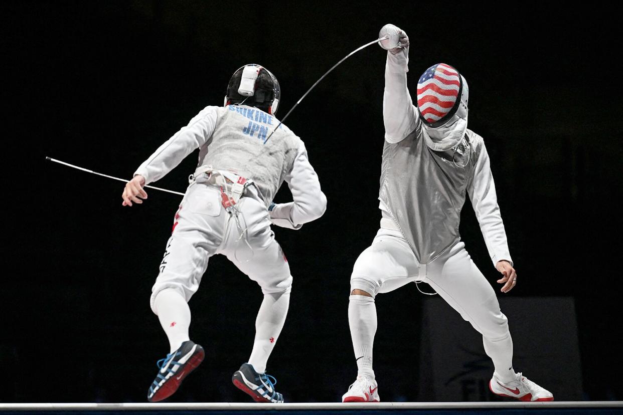 Japan's Takahiro Shikine (L) compete against USA's Gerek Meinhardt in the mens team foil bronze medal bout during the Tokyo 2020 Olympic Games at the Makuhari Messe Hall in Chiba City, Chiba Prefecture, Japan, on August 1, 2021.