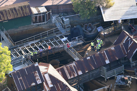 Emergency services personnel can be seen near a ride inside the Dreamworld theme park at Coomera on the Gold Coast, Australia, October 25, 2016 after a number of people were reported killed on a ride at Australia's biggest theme park. AAP/Dan Peled/via REUTERS