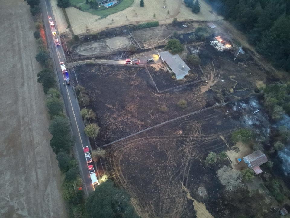 Firefighters saved two homes on Jory Hill Road S on Aug. 23, 2023, during the Liberty Fire just south of Salem. Two outbuildings were destroyed on one of the properties as seen in the upper right-hand corner of this image taken by a Salem Police Department drone pilot.