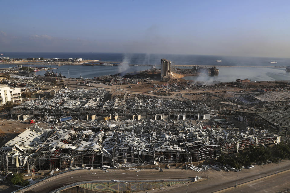 FILE- This photo shows a general view of the scene of an explosion that hit the seaport of Beirut, Lebanon, Wednesday, Aug. 5, 2020. On Aug. 4, 2020, a catastrophic explosion struck Beirut's port, killing at least 216 people and wrecking large parts of the city. The blast, widely considered one of the largest non-nuclear explosions in history, was caused by the detonation of hundreds of tons of ammonium nitrate that was stored in a warehouse for years. (AP Photo/Bilal Hussein, File)