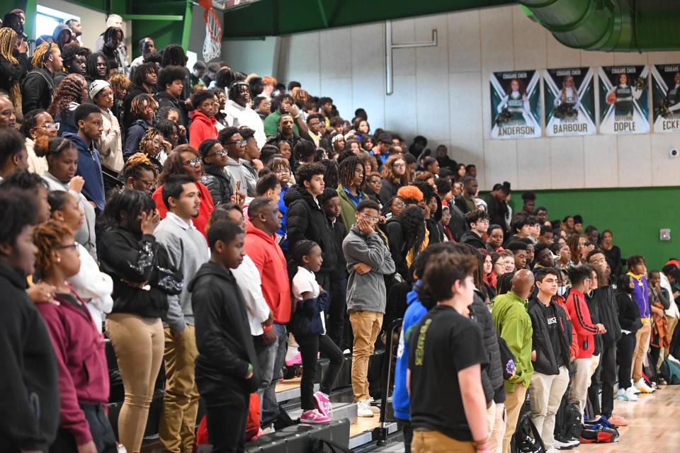 Students rise as the Black national anthem "Lift Every Voice and Sing" plays during the JCM Black History Month Celebration inside Jackson Central-Merry High School on Wednesday, Feb. 28, 2024.