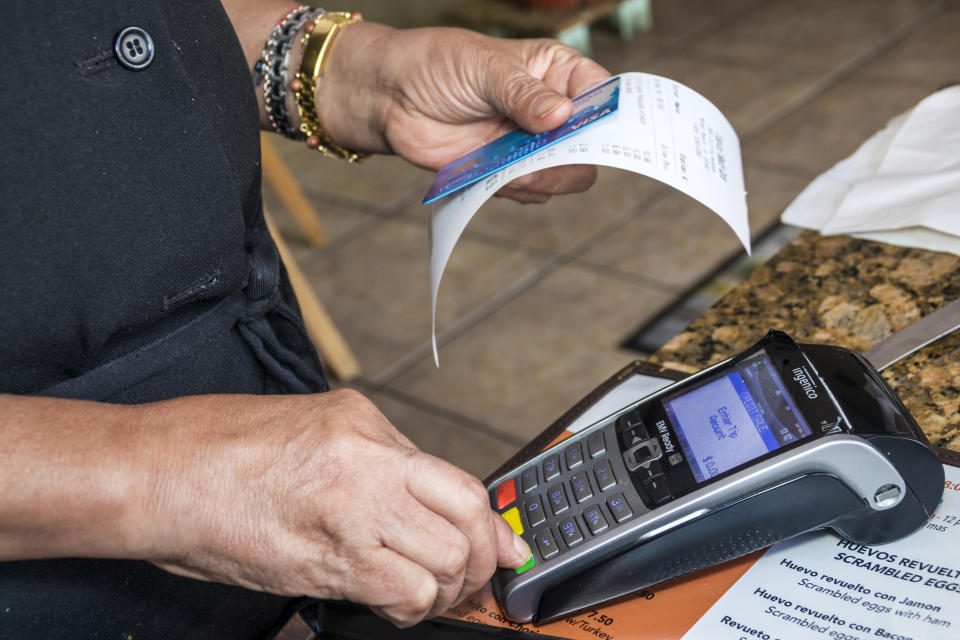 Miami Beach, Tropical Beach Cafe credit card scanner. (Photo by: Jeffrey Greenberg/Universal Images Group via Getty Images)