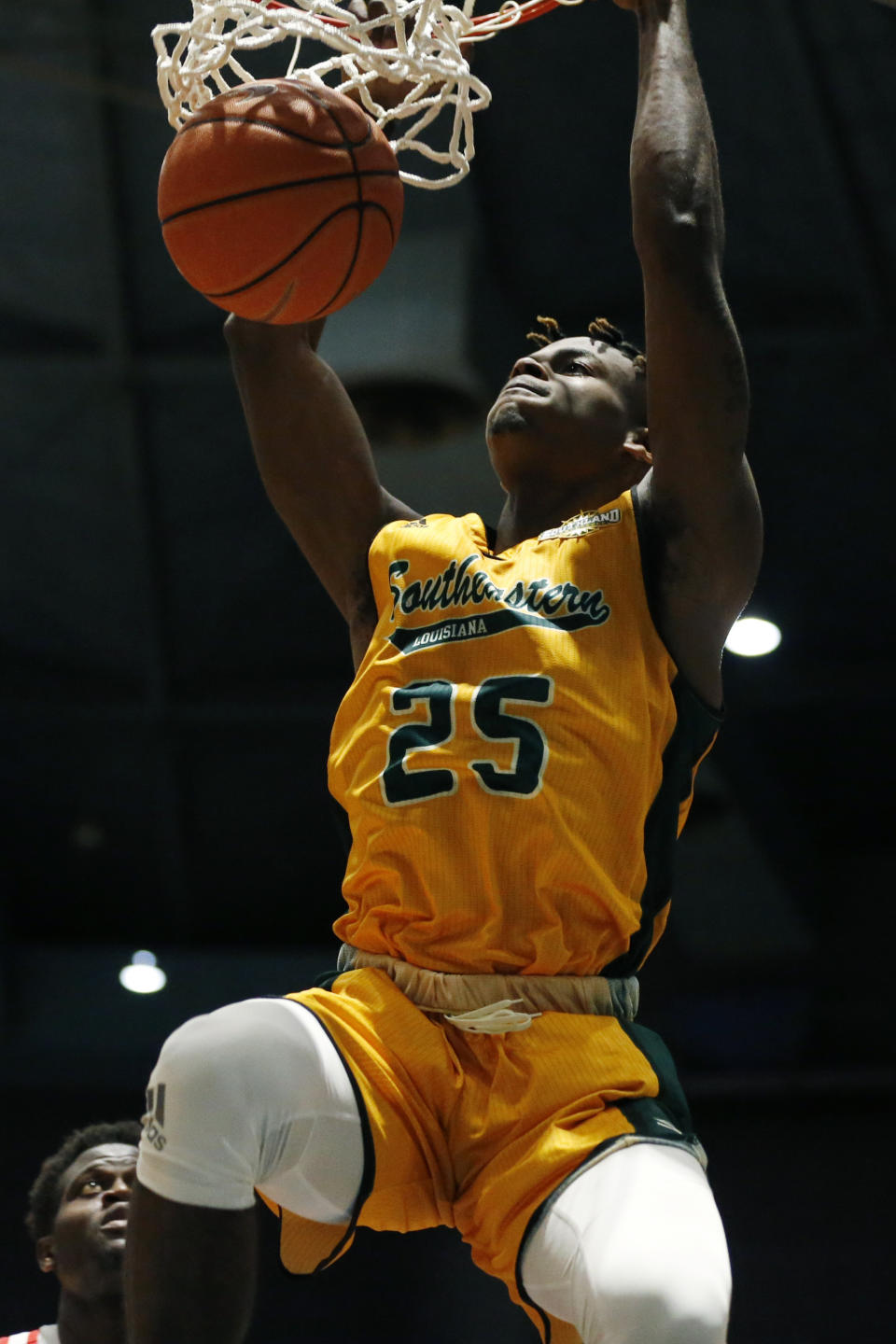 Southeastern Louisiana forward Ty Brewer (25) hangs on the basket after dunking against Mississippi during the second half of an NCAA college basketball game, Saturday, Dec. 21, 2019, in Jackson, Miss. Mississippi won 83-76.(AP Photo/Rogelio V. Solis)