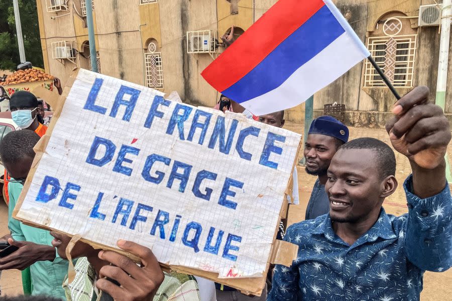 A protester in Niger’s capital holds an anti-France sign placard during an Aug. 3 demonstration as security concerns were building ahead of planned protests. France demanded safety guarantees for foreign embassies as some Western nations reduced their diplomatic presence. (Photo credit: AFP via Getty Images)