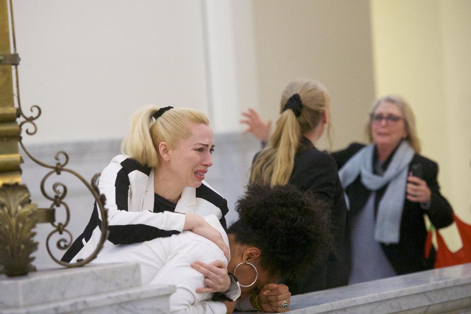 <p>Bill Cosby accusers (L-R) Caroline Heldman, Lili Bernard and Victoria Valentino (far right) react after the guilty on all counts verdict was delivered in the sexual assault retrial at the Montgomery County Courthouse on April 26, 2018 in Norristown, Pa. (Photo: Mark Makela/Getty Images) </p>