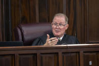 Superior Court Judge Timothy Walmsley speaks with the defense attorneys about a motion regarding questioning a juror during jury selection for the trial of Greg and Travis McMichael and a neighbor, William "Roddie" Bryan, at the Glynn County Courthouse, Monday, Oct. 25, 2021, in Brunswick, Ga. The three are charged with the February 2021 slaying of 25-year-old Ahmaud Arbery. (AP Photo/Stephen B. Morton, Pool)