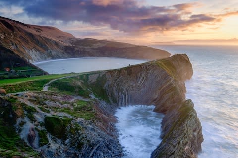 A three-night stay at Lulworth Cove in Dorset for a family of four costs about the same as a Nintendo Switch, one of the most-searched toys for this Christmas - Credit: LOOP IMAGES