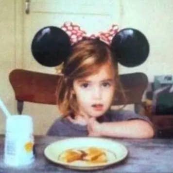 Photo of a toddler-aged Emma Roberts wearing Mickey Mouse ears