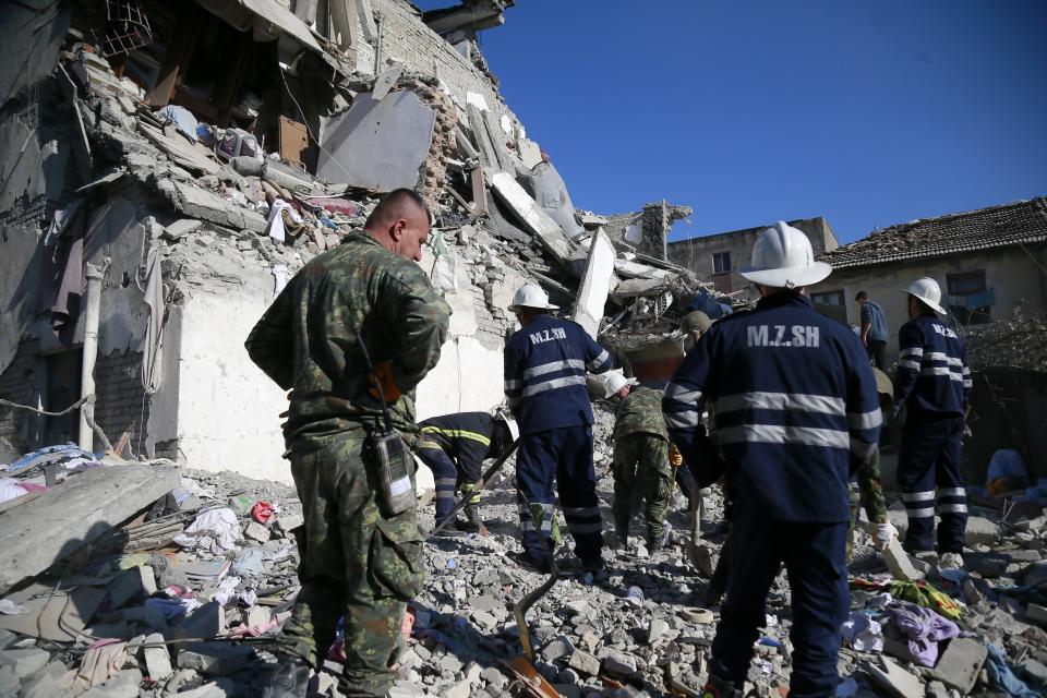 Rescuers search at a damaged building after a magnitude 6.4 earthquake in Thumane, western Albania, Tuesday, Nov. 26, 2019. (Photo: Visar Kryeziu/AP)