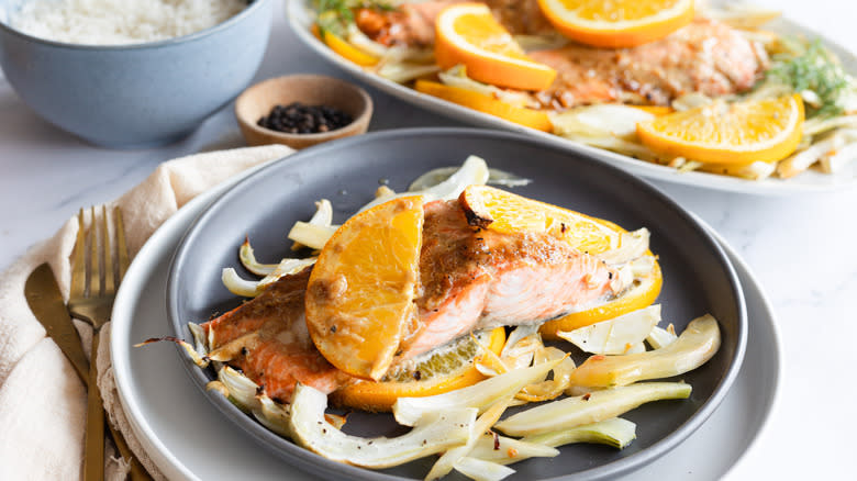 plate of marmalade salmon next to dish on platter