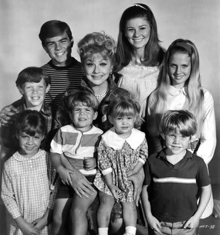 <p>Michael Ochs Archives/Getty</p> Actress Lucille Ball with actors Jennifer Leak, Kevin Burchett, Kimberly Beck, Margot Jane, Eric Shea, Greg Atkins, Lynnell Atkins pose for the movie "Yours, Mine and Ours."