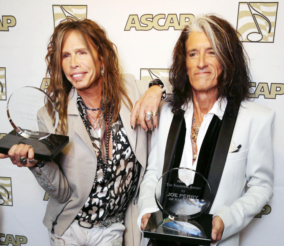 FILE - In this April 8, 2013 photo, Steven Tyler, left, and Joe Perry, recipients of the ASCAP Founders Award, pose with their awards at the ASCAP Press Conference held at the Sunset Marquis, in Los Angeles. Tyler and Perry will be honored with the award during ASCAP's 30th annual Pop Music Awards at a gala on April 17, 2013, in Los Angeles. (Photo by Eric Charbonneau/Invision/AP, File)